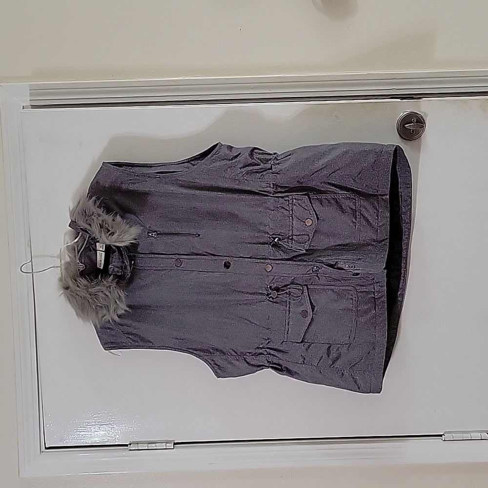 Kim Roger's grey vest